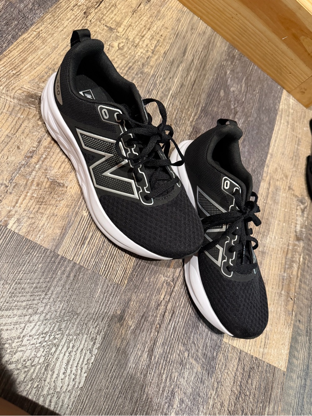 New Balance Black Athletic Running Shoes with White Soles